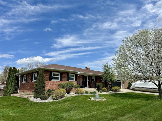 single story home with brick siding, a chimney, driveway, and a front yard