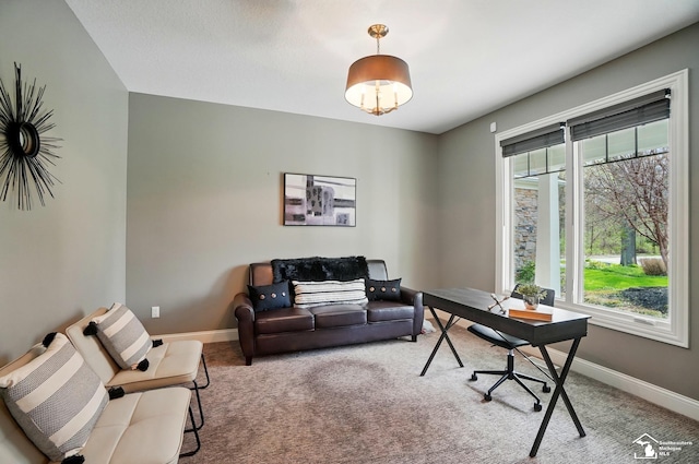 carpeted office featuring baseboards and a healthy amount of sunlight