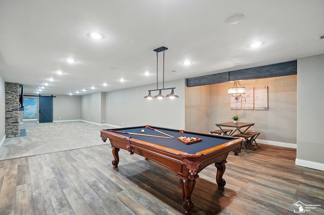 game room featuring pool table, baseboards, a barn door, and wood finished floors