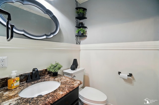half bath with vanity and toilet