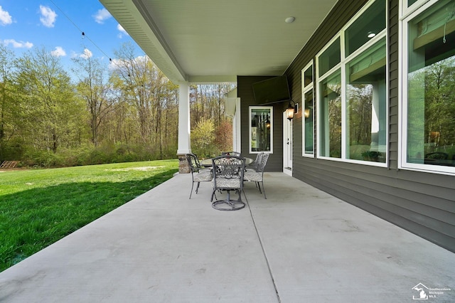 view of patio featuring outdoor dining area