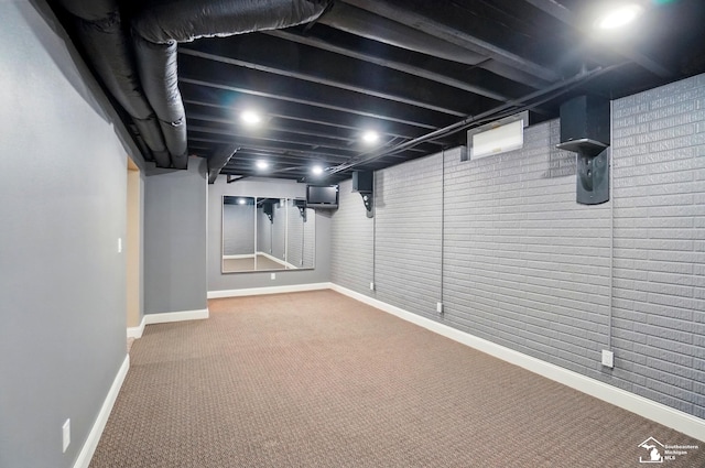 finished basement with baseboards and carpet floors