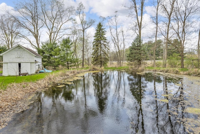 view of water feature with a barn