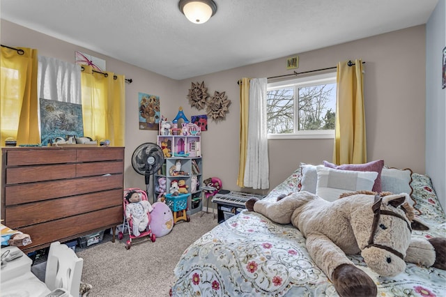 bedroom with carpet flooring and a textured ceiling