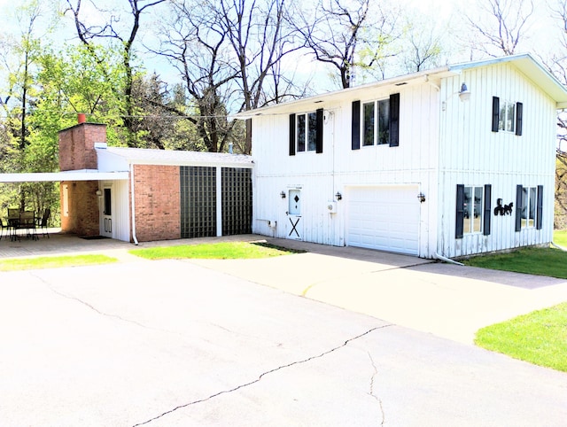 3100 Whipple Rd, Jackson, MI 49201 - exterior space with concrete driveway and a carport
