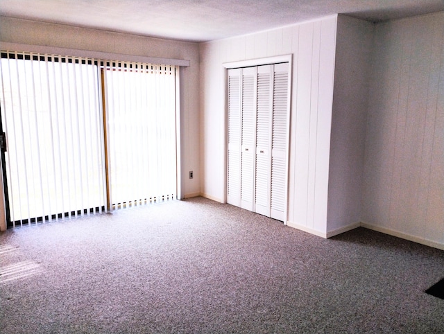 3100 Whipple Rd, Jackson, MI 49201 - unfurnished bedroom with carpet flooring, baseboards, and a closet