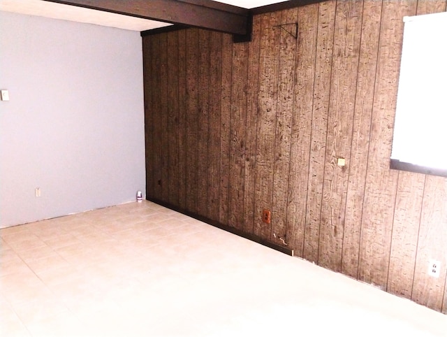 3100 Whipple Rd, Jackson, MI 49201 - empty room featuring wood walls and beamed ceiling