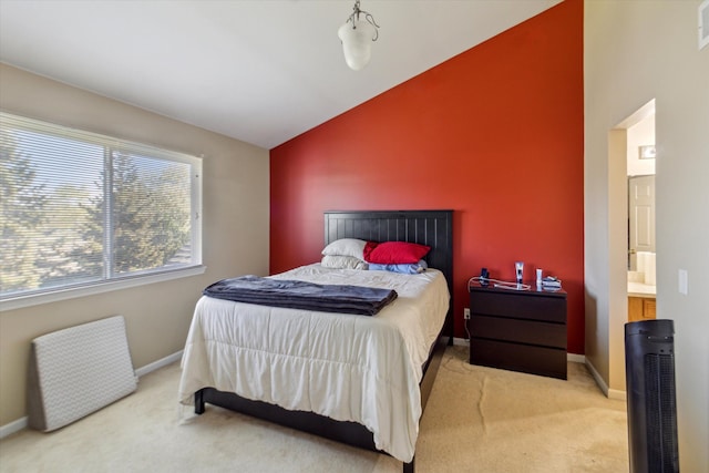 carpeted bedroom with baseboards, lofted ceiling, and visible vents
