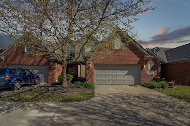 traditional home with brick siding and driveway