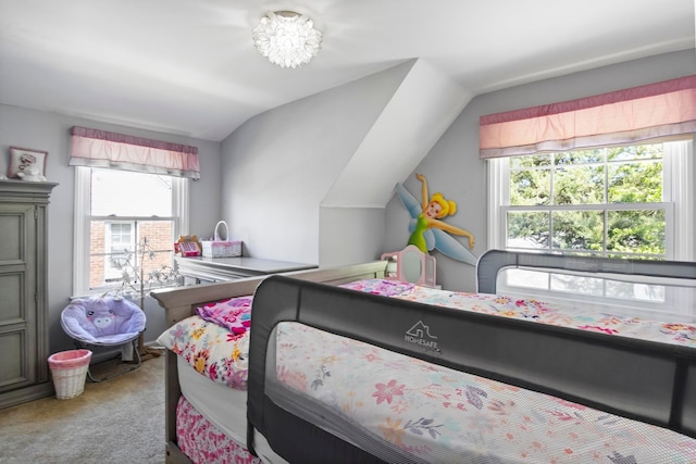 carpeted bedroom featuring lofted ceiling