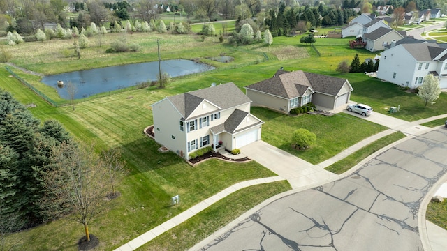 bird's eye view with a residential view and a water view