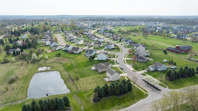 aerial view with a residential view and a water view