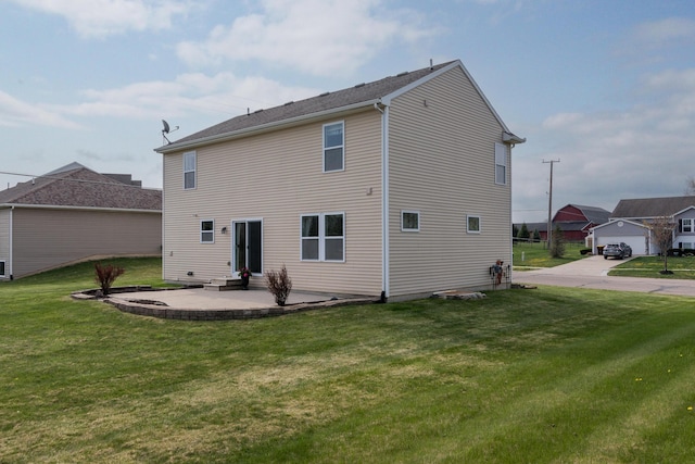 rear view of house featuring a lawn, a patio, and entry steps