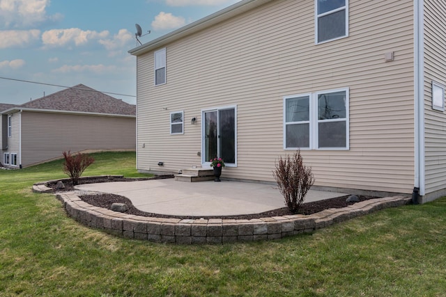back of house featuring a yard and a patio area