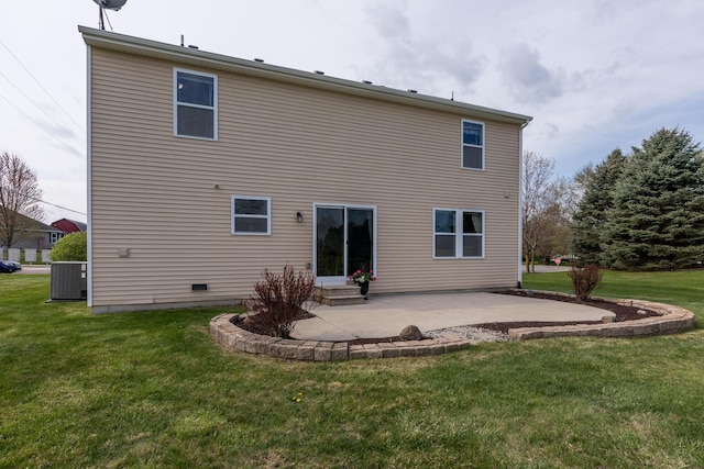 back of house featuring a lawn, entry steps, central AC unit, and a patio area