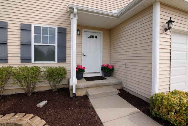 doorway to property with an attached garage