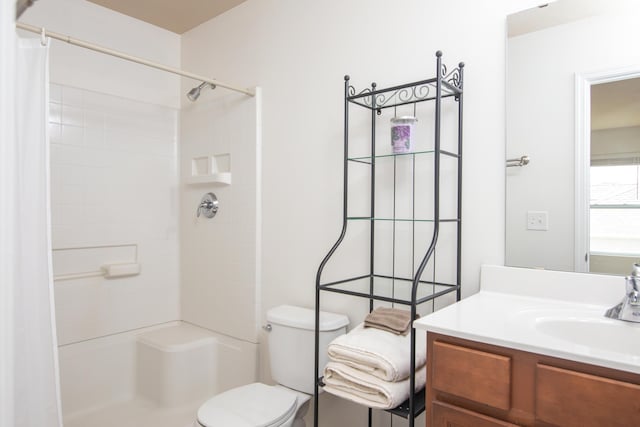 bathroom with vanity, toilet, and a shower with curtain