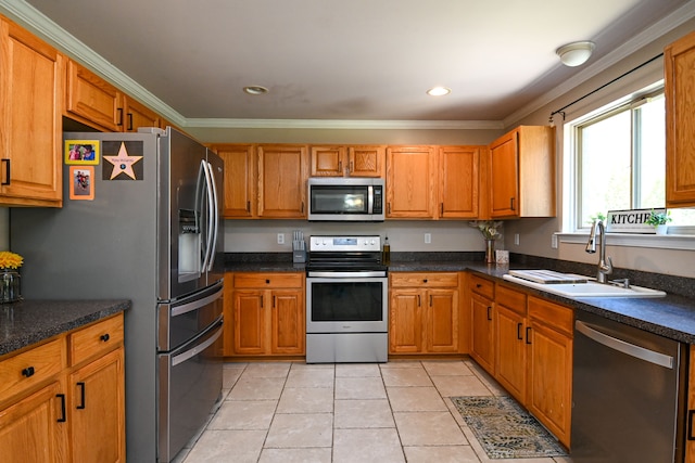 51466 Promenade Ln, New Baltimore, MI 48047 - kitchen with stainless steel appliances, a sink, crown molding, light tile patterned floors, and dark countertops