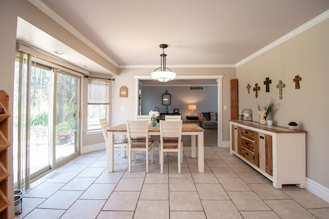 51466 Promenade Ln, New Baltimore, MI 48047 - dining space with crown molding, baseboards, and light tile patterned floors
