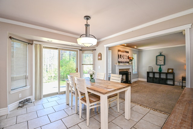 51466 Promenade Ln, New Baltimore, MI 48047 - dining space with a fireplace, light tile patterned floors, baseboards, and ornamental molding