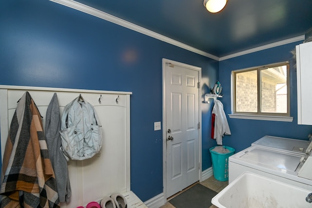 51466 Promenade Ln, New Baltimore, MI 48047 - laundry room with washer and dryer, baseboards, and crown molding