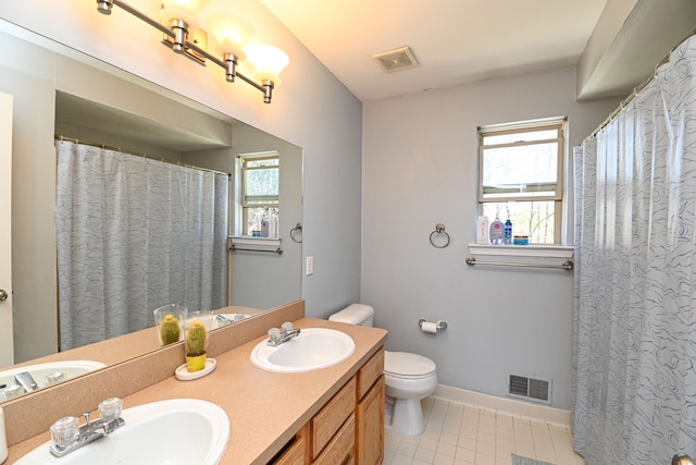 51466 Promenade Ln, New Baltimore, MI 48047 - bathroom featuring tile patterned flooring, toilet, double vanity, and baseboards