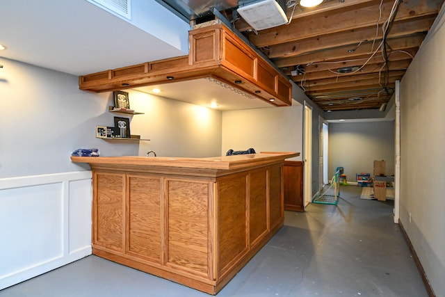 51466 Promenade Ln, New Baltimore, MI 48047 - indoor wet bar featuring concrete flooring and wainscoting