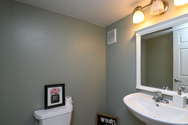 51466 Promenade Ln, New Baltimore, MI 48047 - half bathroom with a sink and toilet