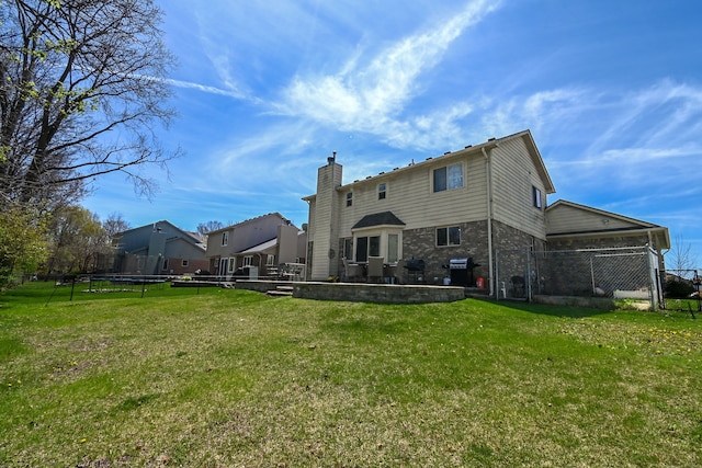 51466 Promenade Ln, New Baltimore, MI 48047 - back of house featuring a patio, a chimney, and brick siding