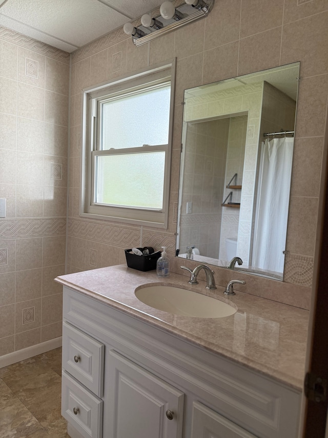 full bathroom featuring vanity and curtained shower