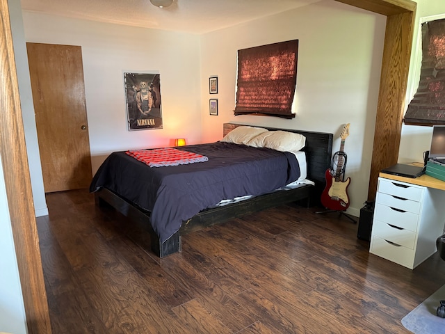 bedroom featuring wood finished floors