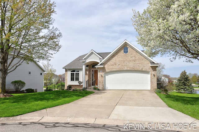 traditional-style house featuring an attached garage, a shingled roof, brick siding, a front yard, and concrete driveway