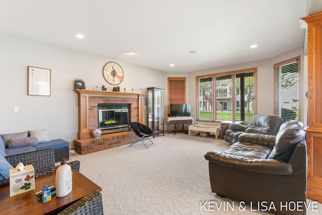 living room featuring carpet floors, recessed lighting, and a brick fireplace