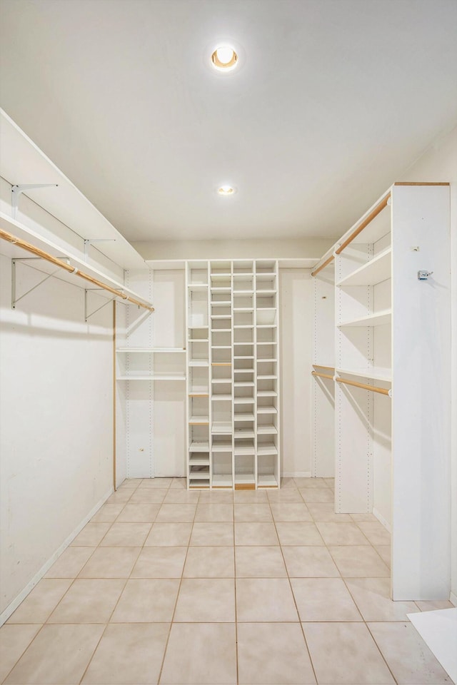 spacious closet featuring light tile patterned floors