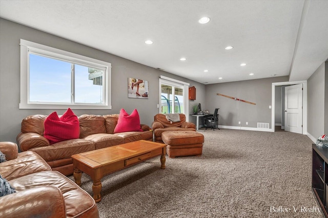 carpeted living room featuring visible vents, recessed lighting, and baseboards