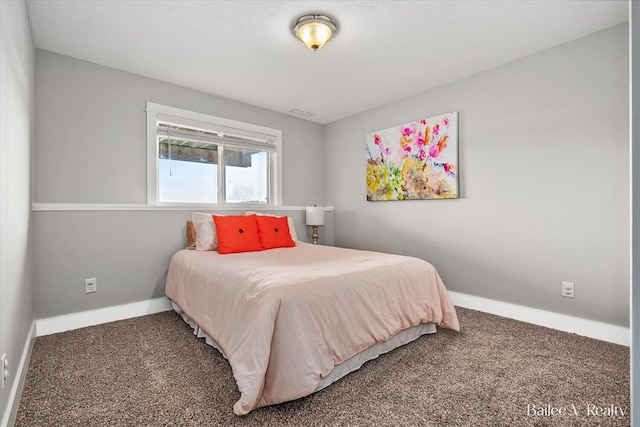 carpeted bedroom featuring baseboards