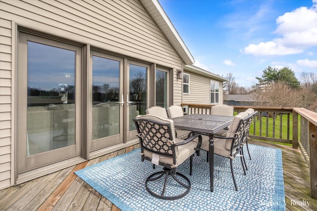 deck with outdoor dining area