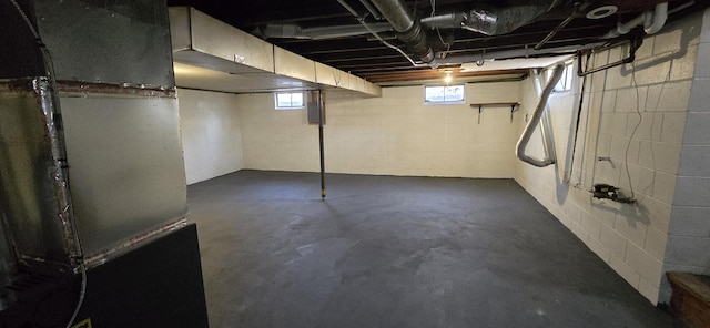 basement with heating unit and electric panel