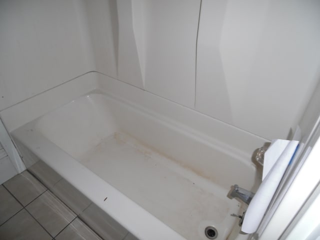 full bathroom featuring tile patterned floors