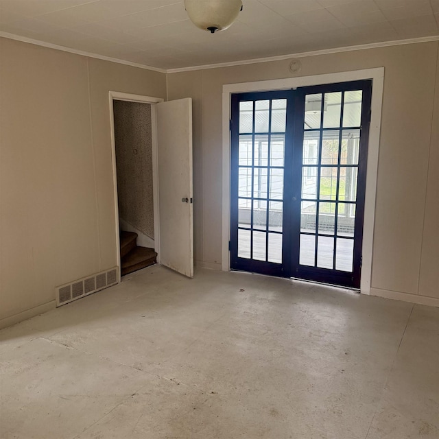 empty room featuring stairs, unfinished concrete flooring, visible vents, and ornamental molding