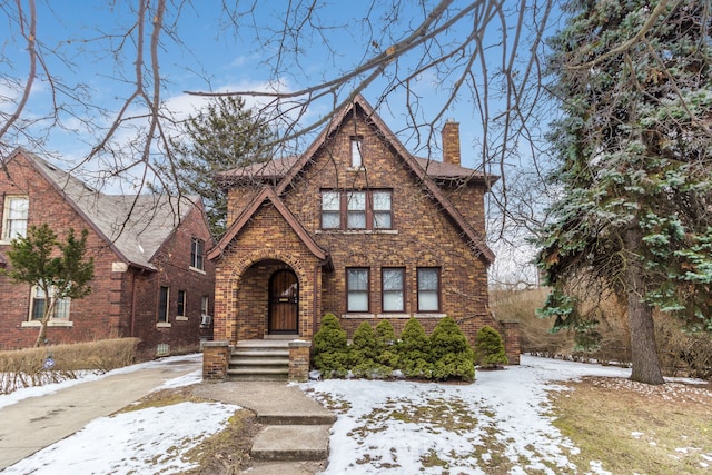 16924 Muirland St, Detroit, MI 48221 - tudor house featuring brick siding and a chimney