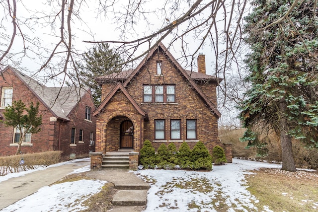 16924 Muirland St, Detroit, MI 48221 - tudor-style house with brick siding and a chimney