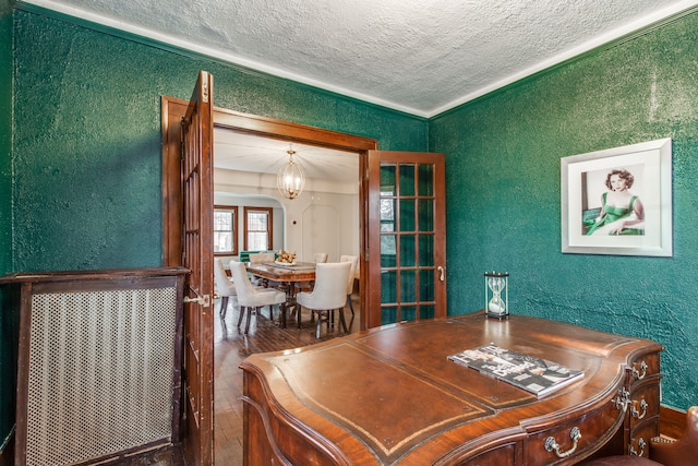 16924 Muirland St, Detroit, MI 48221 - office space with wood finished floors, a textured wall, a textured ceiling, and a chandelier