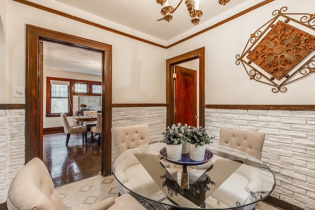 16924 Muirland St, Detroit, MI 48221 - dining area featuring an inviting chandelier, crown molding, and wainscoting