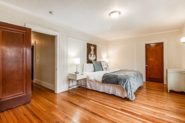 16924 Muirland St, Detroit, MI 48221 - bedroom with light wood-style floors, baseboards, and ornamental molding