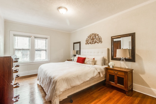 16924 Muirland St, Detroit, MI 48221 - bedroom with crown molding, a textured ceiling, baseboards, and dark wood finished floors