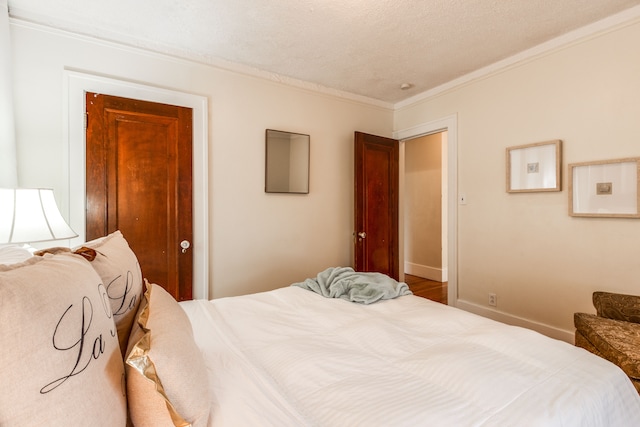 16924 Muirland St, Detroit, MI 48221 - bedroom with a textured ceiling, ornamental molding, and baseboards