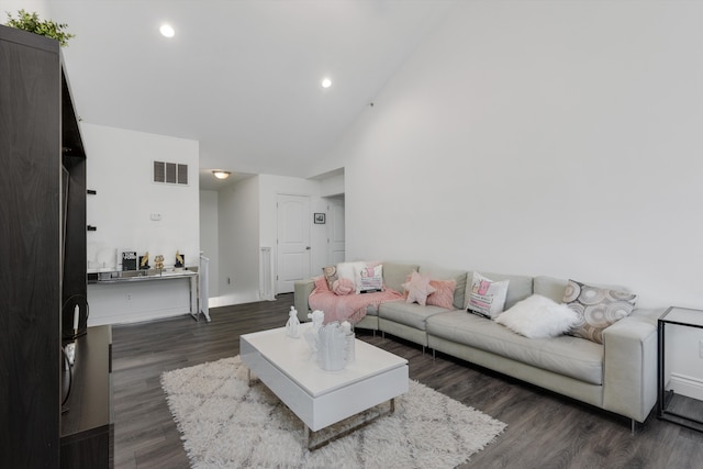 living area featuring dark wood-style flooring, high vaulted ceiling, recessed lighting, baseboards, and visible vents