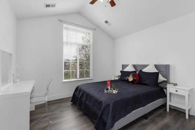 bedroom featuring visible vents, multiple windows, and wood finished floors