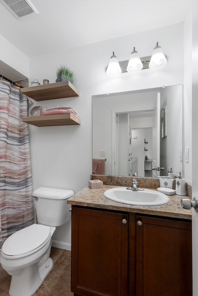bathroom with toilet, visible vents, a shower with shower curtain, and vanity